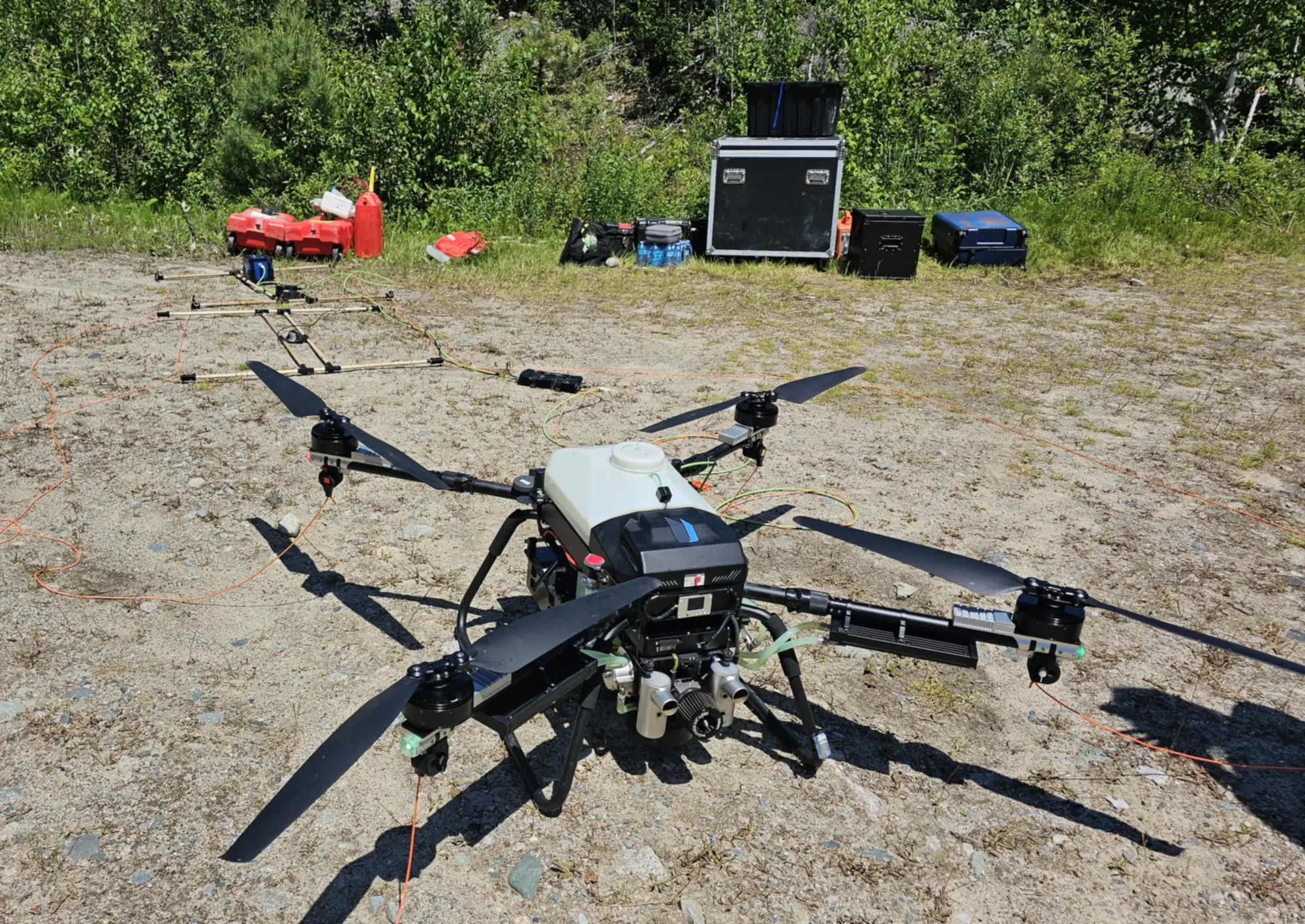 A Rosor Recon Heavy set up on a gravel pad at a field site, ready to fly